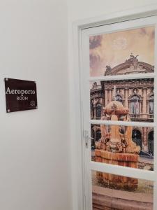 a door with a sign that reads aeroport room at Casa Sofia in Catania