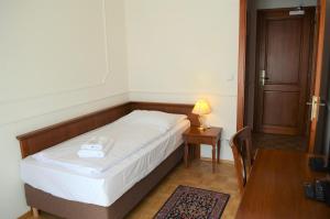 Łóżko lub łóżka w pokoju w obiekcie Hotel Renesance Krasna Kralovna