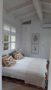 En eller flere senge i et værelse på Villa Monti Di Li Femini