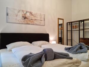 Ένα ή περισσότερα κρεβάτια σε δωμάτιο στο Pension Mozart - Newly Renovated