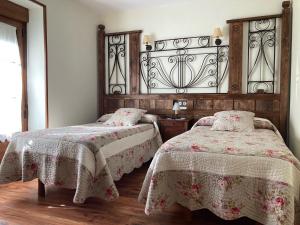 Ένα ή περισσότερα κρεβάτια σε δωμάτιο στο B&B El Caminero