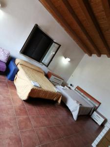 a living room with a flat screen tv on the wall at Villa Patrizia in Canicattì