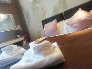 a bedroom with a bed with towels on it at Hotel Sereno in Sestri Levante