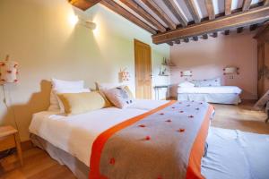 Maisons d'hôtes - Domaine Le Coq Enchanté客房内的一张或多张床位