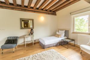 Maisons d'hôtes - Domaine Le Coq Enchanté客房内的一张或多张床位