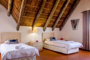 Ένα ή περισσότερα κρεβάτια σε δωμάτιο στο Silversands Beach Villa