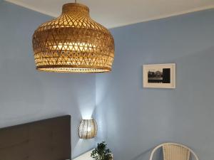 a chandelier hanging from a ceiling in a room at Giata home in Naples