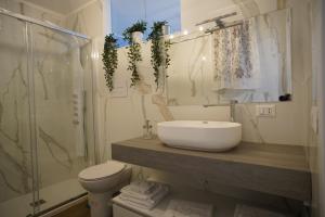 a bathroom with a sink and a toilet at Giata home in Naples