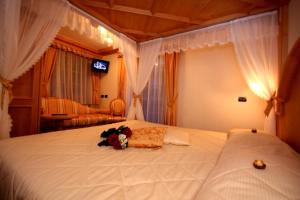 Garnì Val de Costa tesisinde bir odada yatak veya yataklar