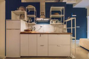 A kitchen or kitchenette at Rione Monti Studio Apt with private garden