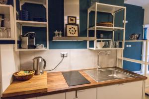 A kitchen or kitchenette at Rione Monti Studio Apt with private garden