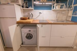 A kitchen or kitchenette at Rione Monti Studio Apt with private garden