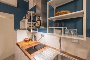 A kitchen or kitchenette at Rione Monti Studio Apt with private garden