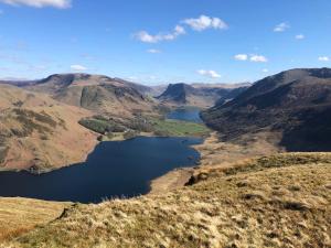 a view of a lake in the mountains at Wood House Cottage in Cockermouth