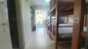 a hallway with bunk beds in a room at POUSADA CASA DIAMANTe in Cabo Frio +29 photos