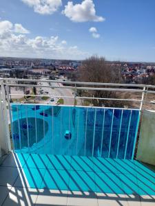 a swimming pool on the roof of a building at Apartament Nad Parsętą in Kołobrzeg