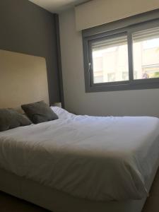 Postel nebo postele na pokoji v ubytování Simmer-Villa Amalia 4
