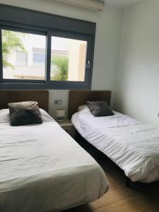 Postel nebo postele na pokoji v ubytování Simmer-Villa Amalia 4
