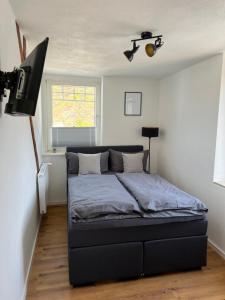 Ein Bett oder Betten in einem Zimmer der Unterkunft Weingut Gästehaus Bach