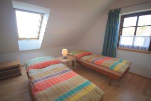 Posteľ alebo postele v izbe v ubytovaní Apartmán V sadu