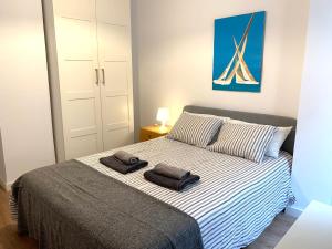 En eller flere senge i et værelse på 2 Apartamento TERRAZA Free Wifi