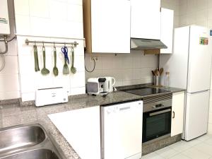 Kuchyň nebo kuchyňský kout v ubytování 2 Apartamento TERRAZA Free Wifi