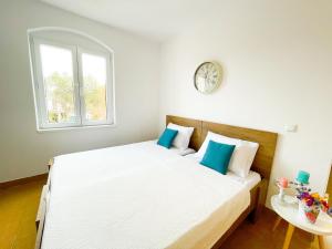 Posteľ alebo postele v izbe v ubytovaní Spacious Apartment Amaros