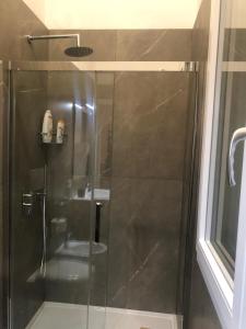 a shower with a glass door in a bathroom at Josephine Holidays in Lecce +58 photos