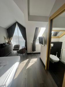 Postel nebo postele na pokoji v ubytování Hotel Oostereiland