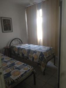 Katil atau katil-katil dalam bilik di Ed. Thereza Cristina melhor opção Cabo Frio