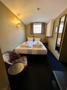 Postel nebo postele na pokoji v ubytování Hotel Oostereiland