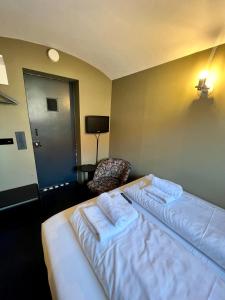 Postel nebo postele na pokoji v ubytování Hotel Oostereiland