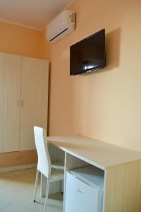 TV a/nebo společenská místnost v ubytování Le Twins -Bed and Breakfast
