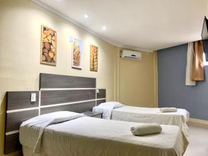 a hospital room with two beds in it at HANNA Arcos d'Atalaia Hotel - Aracaju in Aracaju +23 photos