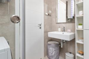 a bathroom with a shower and a sink at Ell Star Apartment in Tivat +24 photos