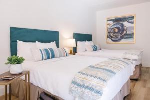 Postel nebo postele na pokoji v ubytování L3 Oasis Hotel