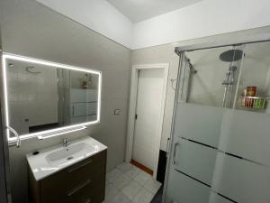 a bathroom with a sink and a shower at candelaria vacaciones centro, playa 20 metros, in center holidays beach at 20 meters in Candelaria