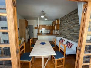 a kitchen and dining room with a table and chairs at candelaria vacaciones centro, playa 20 metros, in center holidays beach at 20 meters in Candelaria