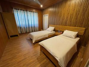 Voodi või voodid majutusasutuse Indus View Hotel Skardu toas