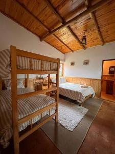 a bedroom with two bunk beds in a room at Bungalow Cajamarca, con Wifi y Cochera in Cajamarca