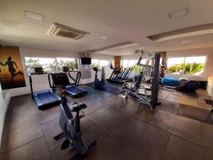 a gym with several treadmills and machines in a room at Via Alameda Studio 706 -GRU- in Guarulhos