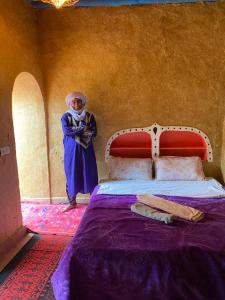 A bed or beds in a room at Dar Yaya