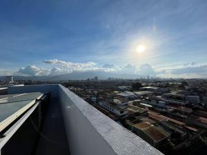 a view of a city from the rooftop of a building at Bambu-Rivera Club Residences in San José