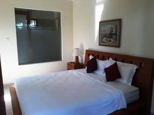 Voodi või voodid majutusasutuse Manggis Sari Guesthouse toas