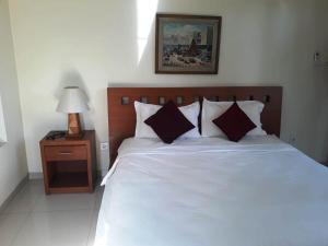 Voodi või voodid majutusasutuse Manggis Sari Guesthouse toas