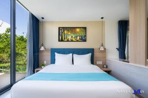 Postelja oz. postelje v sobi nastanitve Oceanami Sea View Villa - Long Hai Vung Tau