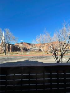 a view of a street with trees and a building at The Kanab Lodge in Kanab