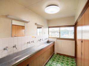 Vannituba majutusasutuses Tabist Hamatoya Ryokan Mens Only