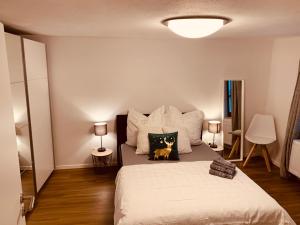 En eller flere senge i et værelse på FELIX LIVING 2, Cozy & modern & Netflix Wohnung mit Blick ins Grüne