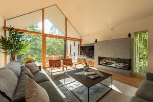 a living room with a couch and a fireplace at Shakuzen in Niseko